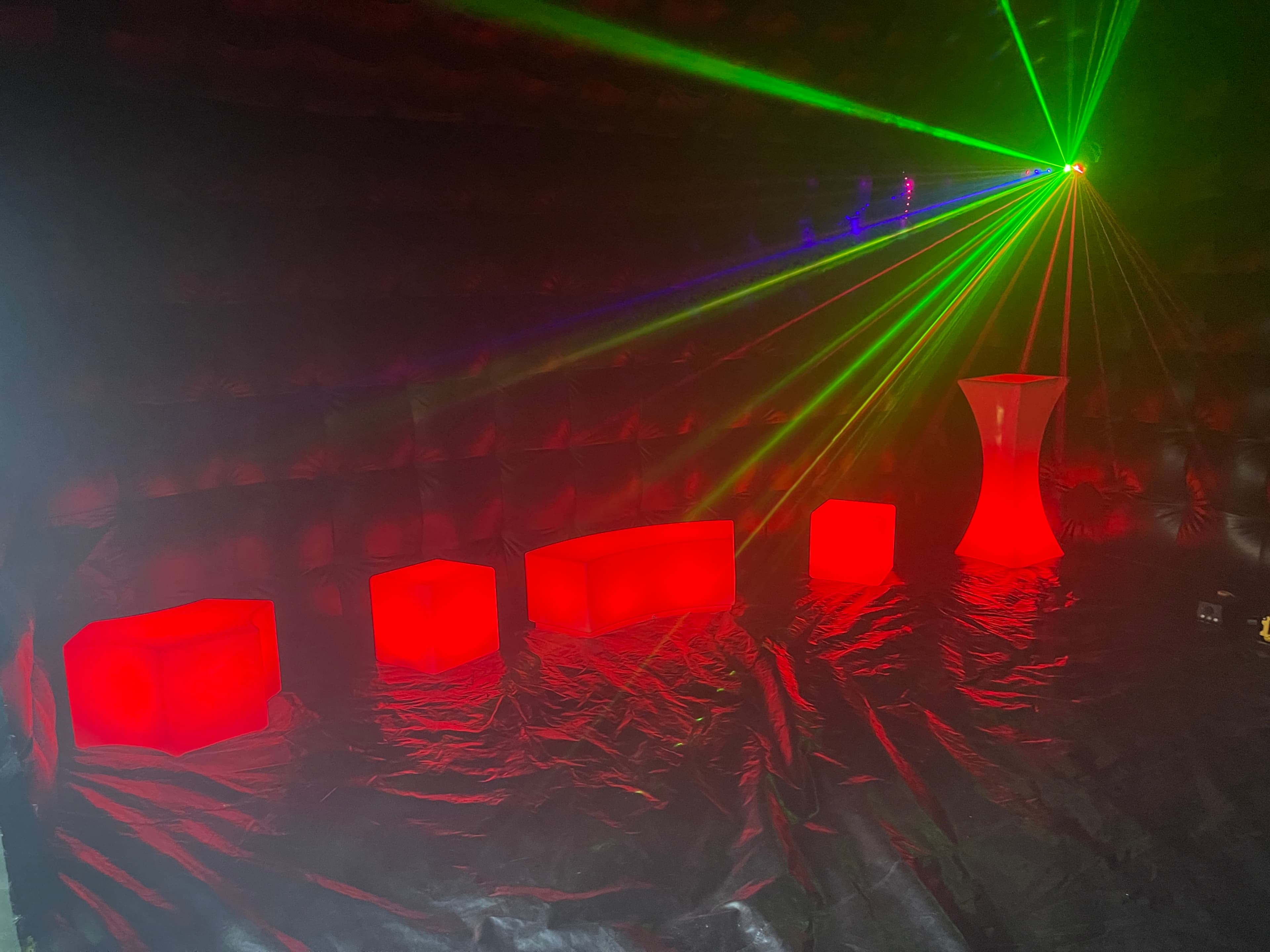 Green lasers and red lights inside a Yard Clubs nightclub
